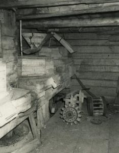 Stones, saw clamp, nut and wallower pinion inside a magpie mill on Luhtas-Köykkä farm in Luopajärvi,