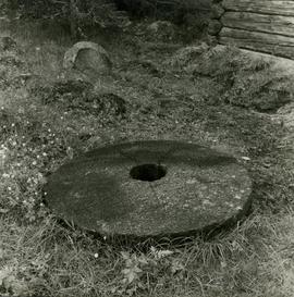 Concave granite millstones at Hauho open-air museum mill in Tammela, Häme