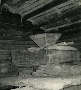 Millstones and hopper in the horizontal watermill in Kalvola, Häme
