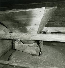 Hopper and stones in the horizontal watermill in Forssa, Finland