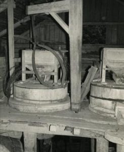 Stones, hoppers and crane in the watermill at Porras in Tammela, Häme