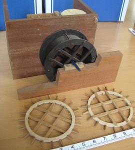 View of exterior of watermill model showing wheels