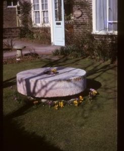 Millstone in garden of house called "Millstones" - probably FWG's