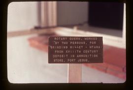 Description plaque accompanying preserved quern