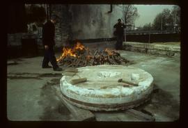 Millstone on ground with dressing(?) tools