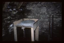 Quern inside unidentified stone building