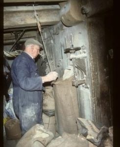 Frank Mettam, miller, at work, Ollerton Mill, Ollerton