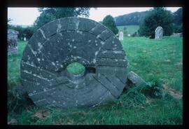 Tombstone in form of French burr stone