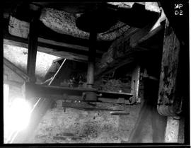 Bridge tree and stone spindle below grey stones, tower mill, South Leverton