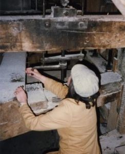 Winding stone nut into gear, Mapledurham Mill, Mapledurham