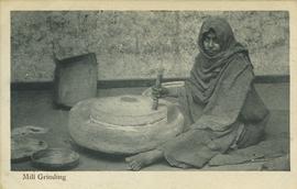 Woman mill grinding