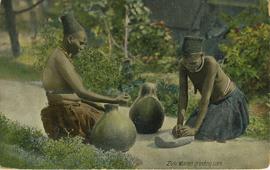 Zulu women grinding corn