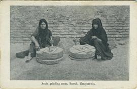 Arabs grinding corn, Basrah, Mesopotamia