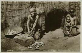 Woman grinding maize