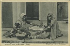 Women grinding corn