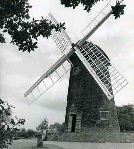 View of the restored mill with staddle stone and millstone