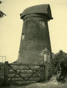 Postcard of mill before restoration, with cap but no sails