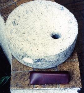 Photograph of a quern runner, Malaysia