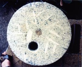 Photograph of a quern runner, Malaysia