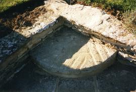 Photograph of a millstone in Abbotswood garden, Gloucestershire