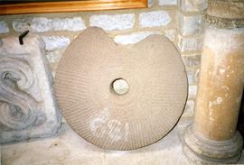 Photograph of a millstone, Chedworth Roman Villa, Gloucestershire