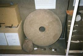 Photograph of a quernstone, Chedworth Roman Villa, Gloucestershire