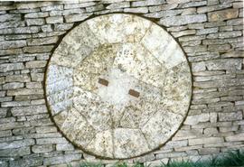 Photograph of a millstone in a wall, Slaughter Farm, Bourton on the Water, Gloucestershire