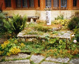 Photograph of a sundial sitting on a millstone, Goddards, Surrey