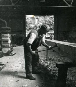 Bob Barber adzing a midling for Black Mill, Barham