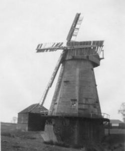 Smock mill, South Ockendon, disused, with shed