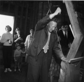 Mr. Bremer on meal floor with tentering handle, Union Mill, Cranbrook
