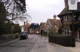 Distant view along lane, showing fire damage