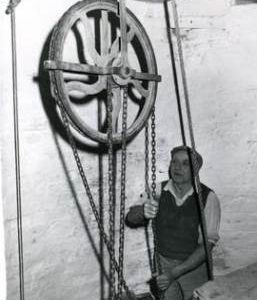 North Leverton Tower Mill, Nottinghamshire, Miller Bill Heathershaw using the sack hoist