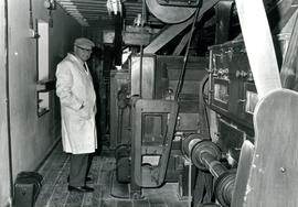 Miller on roller floor, Castle Mill, Beccles, Suffolk