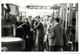 Guests being shown a process in the workshop