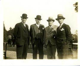 Men posing for picture together