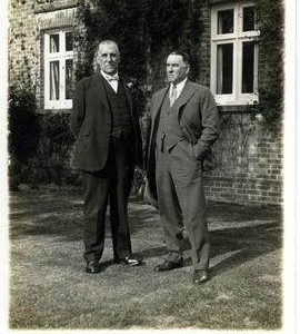 Two men posing for picture