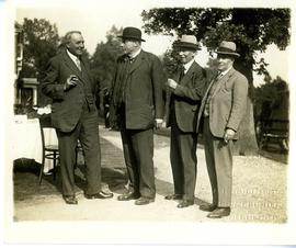 Men posing for picture together