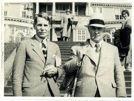 Two men posing for picture