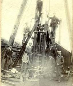 Work crew Posing by industrial Machinery