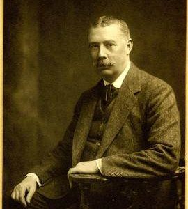 H Ridley Esq. Posing for photographic portrait