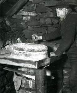 Quern in use in Shetland