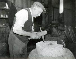 Miller working at a millstone