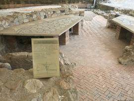 Ruins of Roman villa with sign about milling