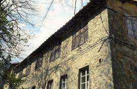 "Italy, Pescia - building beside mill"