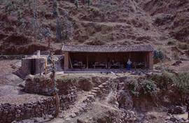 China. Long Zu. Vathouse across valley mulberry.