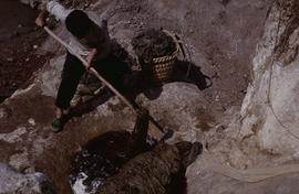 China - Zhenfeng. Long Jin - washing mulberry after cooking.