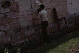 China - Zhenfeng. Long Jin. Pasting coarse sheet on wall