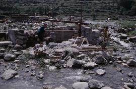 China - Kaili. Ping Liang. Vat & Kollergang in river.