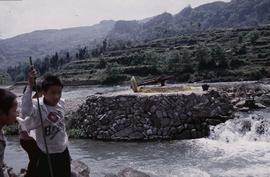 China - Kaili. Ping Liang. Kollergang in river.